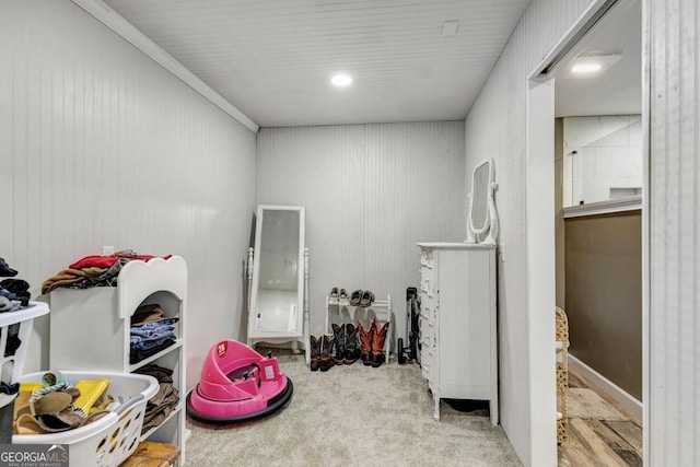 recreation room with carpet flooring