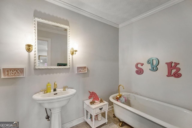 full bathroom with a textured ceiling, ornamental molding, a soaking tub, and tile patterned floors