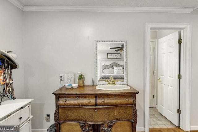 hall featuring crown molding and a sink