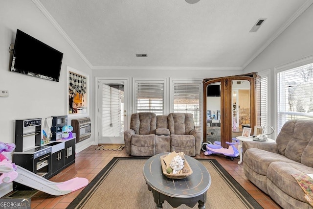 tiled living area featuring lofted ceiling, a textured ceiling, visible vents, and crown molding