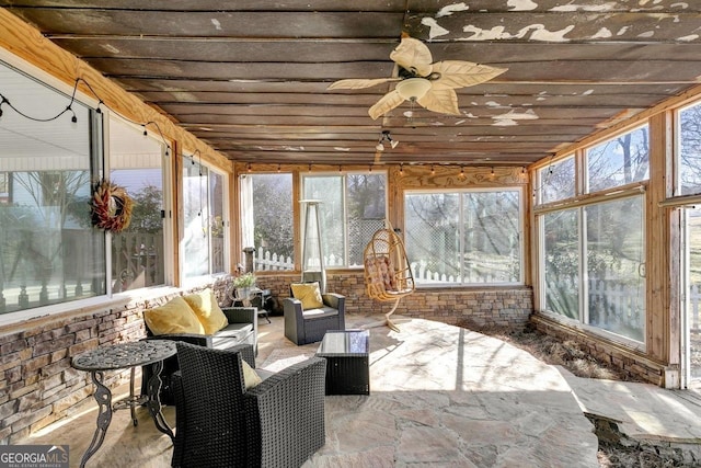 sunroom / solarium with ceiling fan