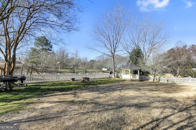 view of yard with a gazebo and a fenced backyard