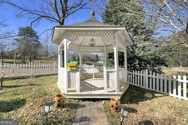 wooden deck with a gazebo and fence