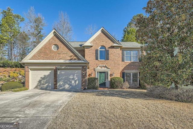 view of front of house with brick siding, driveway, and an attached garage