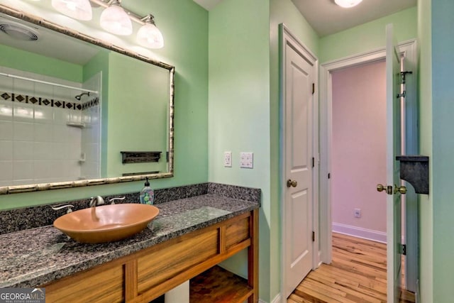 bathroom featuring vanity and wood finished floors