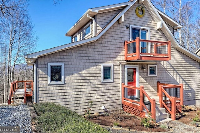 view of front of property with a balcony