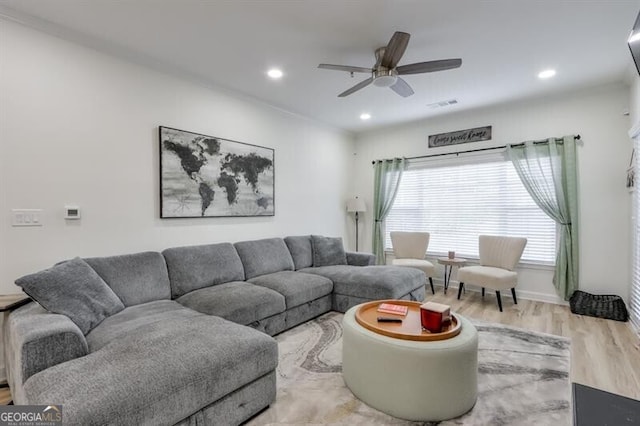 living area with recessed lighting, visible vents, ceiling fan, and wood finished floors