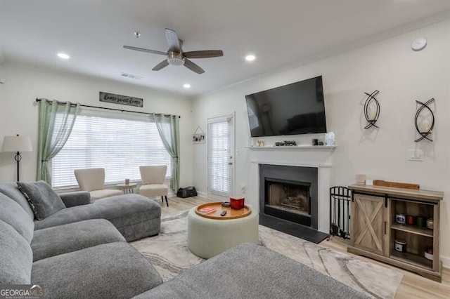 living room with a fireplace, recessed lighting, ceiling fan, wood finished floors, and baseboards