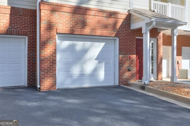 garage with aphalt driveway