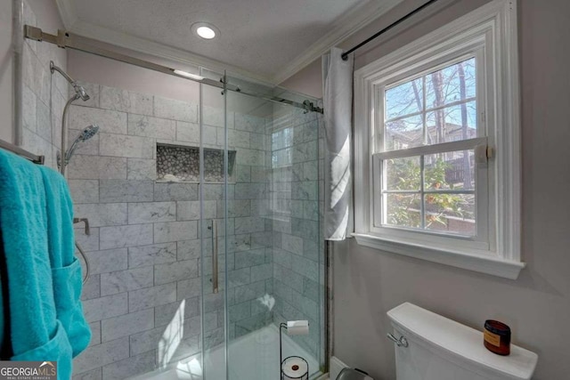 full bath featuring crown molding, a textured ceiling, and toilet