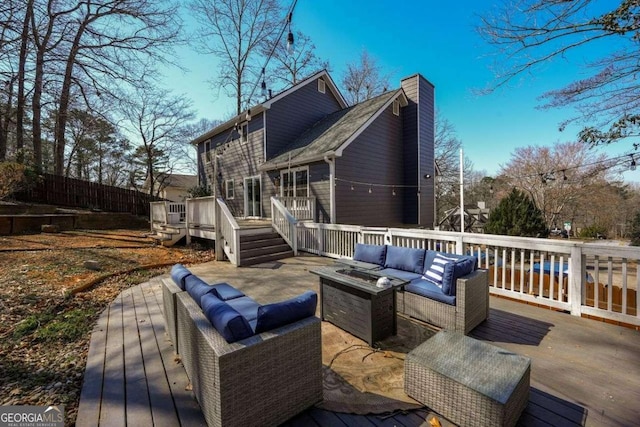 wooden terrace featuring an outdoor hangout area