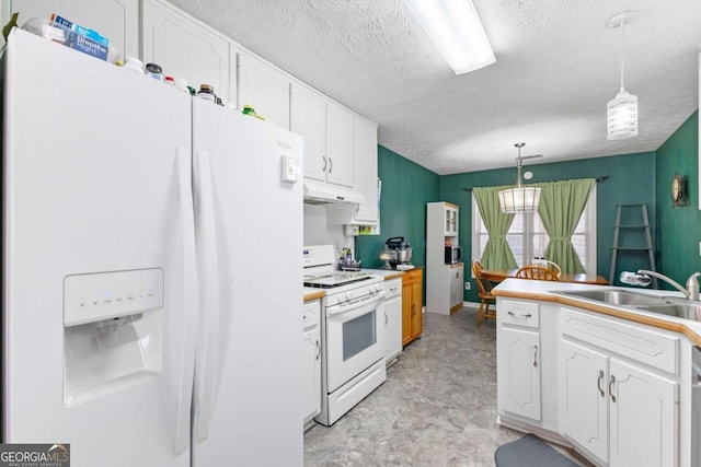 1800 Rockdale Cir, Snellville, GA 30078 - kitchen featuring hanging light fixtures, white cabinets, a textured ceiling, white appliances, and under cabinet range hood