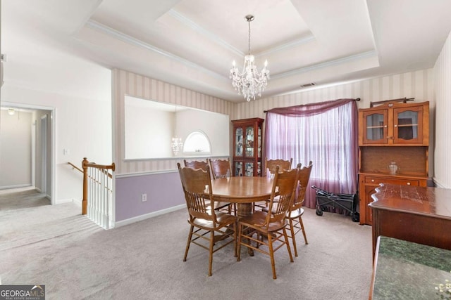 1800 Rockdale Cir, Snellville, GA 30078 - dining area featuring light carpet, baseboards, a raised ceiling, ornamental molding, and an inviting chandelier