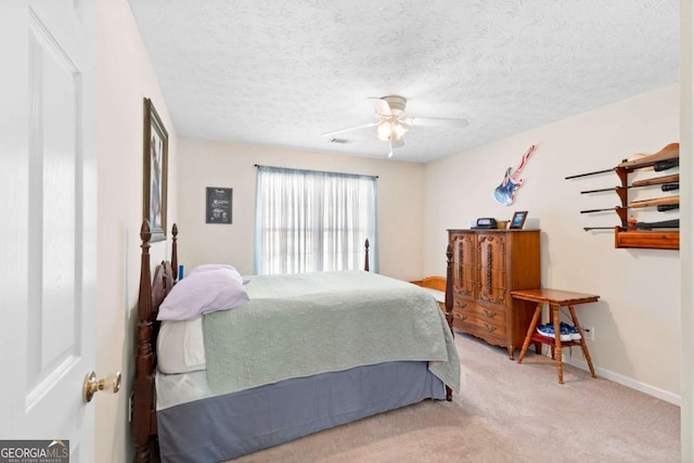 1800 Rockdale Cir, Snellville, GA 30078 - bedroom featuring a textured ceiling, carpet flooring, visible vents, baseboards, and a ceiling fan