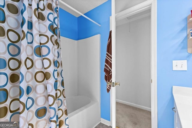 1800 Rockdale Cir, Snellville, GA 30078 - bathroom featuring shower / tub combo, vanity, baseboards, and a textured ceiling