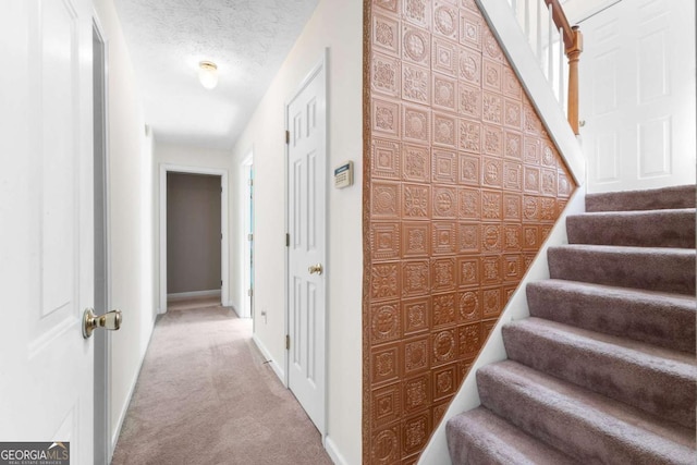 1800 Rockdale Cir, Snellville, GA 30078 - stairway with carpet, a textured ceiling, and baseboards