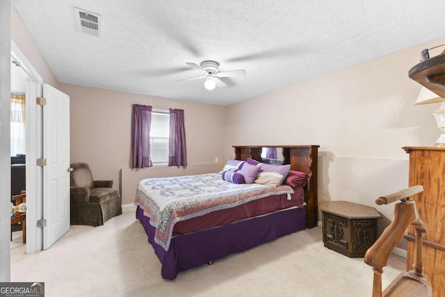 1800 Rockdale Cir, Snellville, GA 30078 - bedroom featuring ceiling fan, a textured ceiling, visible vents, and carpet flooring