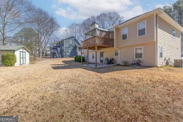 1800 Rockdale Cir, Snellville, GA 30078 - rear view of property featuring a storage shed, a chimney, cooling unit, an outdoor structure, and a patio area