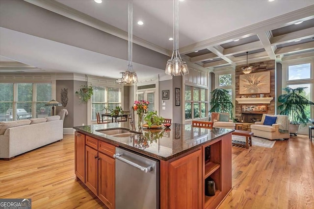 kitchen with open floor plan, brown cabinetry, and a fireplace