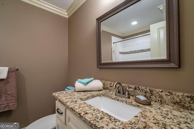 bathroom with ornamental molding, a shower with curtain, vanity, and toilet