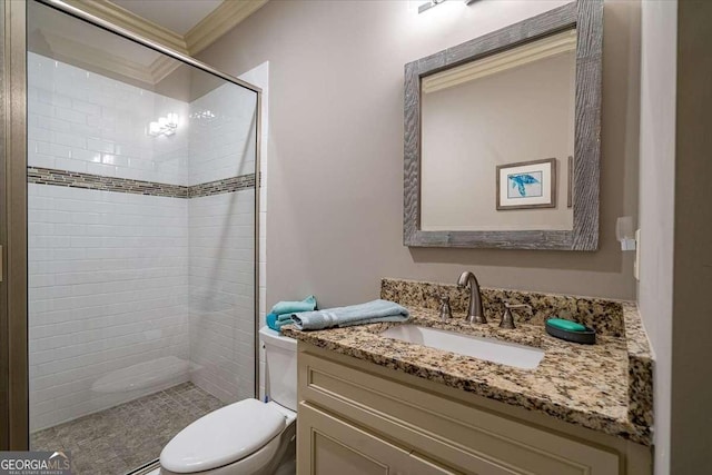 full bathroom featuring toilet, a stall shower, crown molding, and vanity