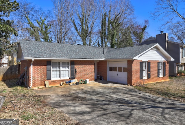 single story home featuring a garage, brick siding, a chimney, and roof with shingles