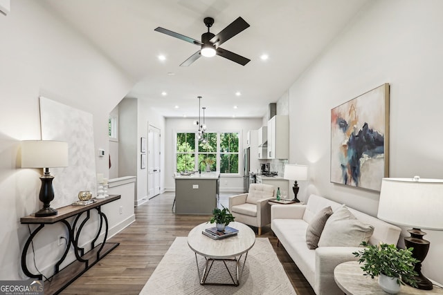 living room with ceiling fan, baseboards, dark wood finished floors, and recessed lighting