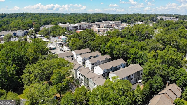 aerial view featuring a residential view and a view of trees