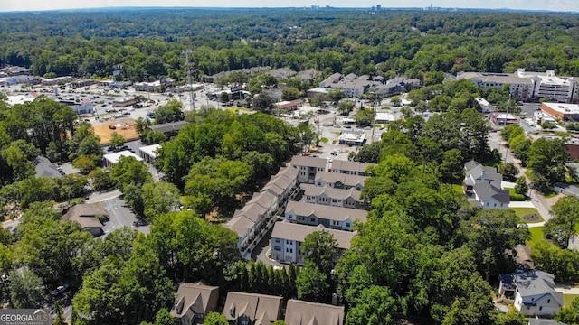 aerial view featuring a forest view and a residential view