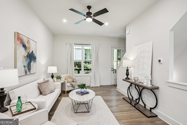 living room featuring recessed lighting, wood finished floors, a ceiling fan, and baseboards