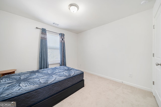 bedroom featuring carpet, visible vents, and baseboards