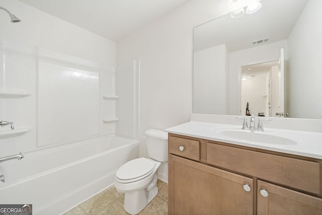 bathroom featuring visible vents, toilet, tile patterned floors, vanity, and washtub / shower combination