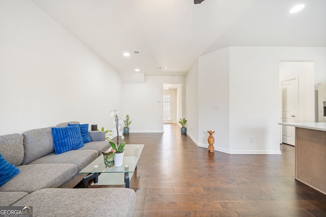 living area featuring dark wood-type flooring, recessed lighting, and baseboards