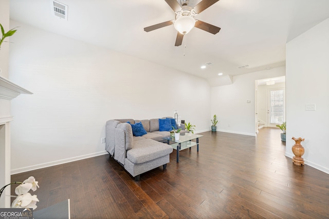 living area with dark wood-type flooring, recessed lighting, visible vents, and baseboards