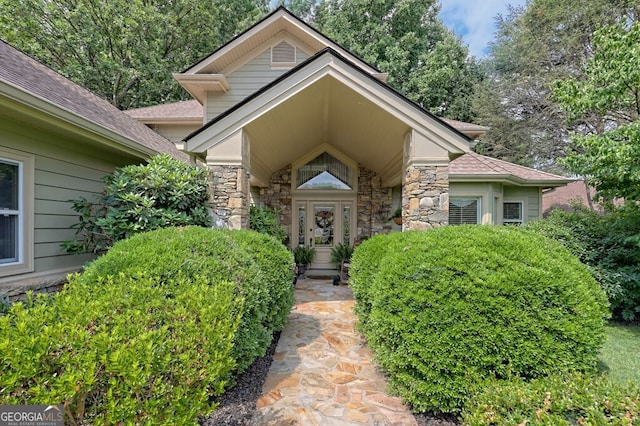 entrance to property featuring stone siding