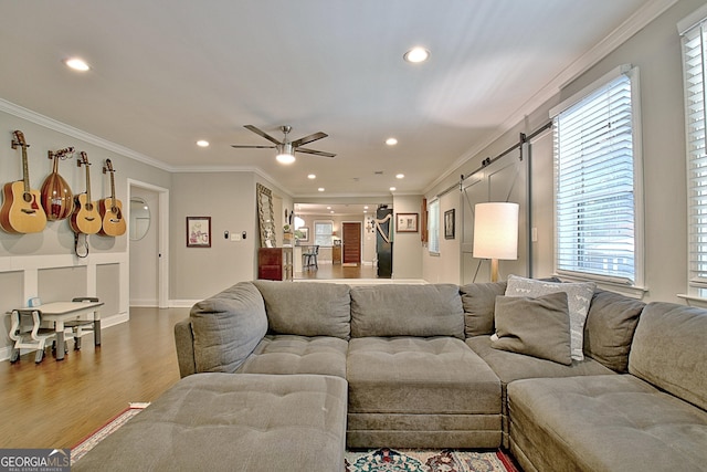 1453 Midview Dr, Decatur, GA 30032 - living room with ornamental molding, recessed lighting, a barn door, and wood finished floors