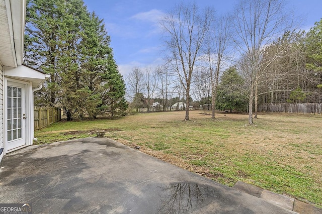 view of yard featuring a patio area and fence