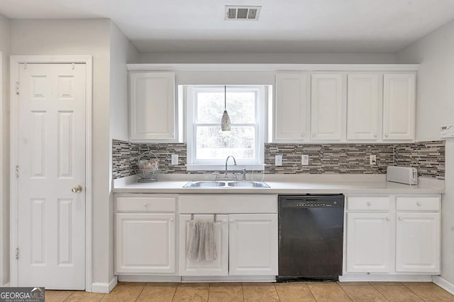 kitchen featuring a sink, visible vents, white cabinetry, light countertops, and dishwasher