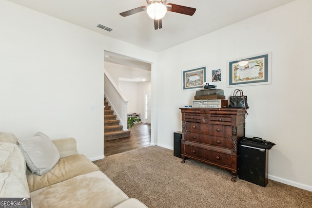 interior space with carpet flooring, visible vents, baseboards, and stairs