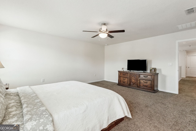 bedroom featuring carpet floors, baseboards, visible vents, and ceiling fan