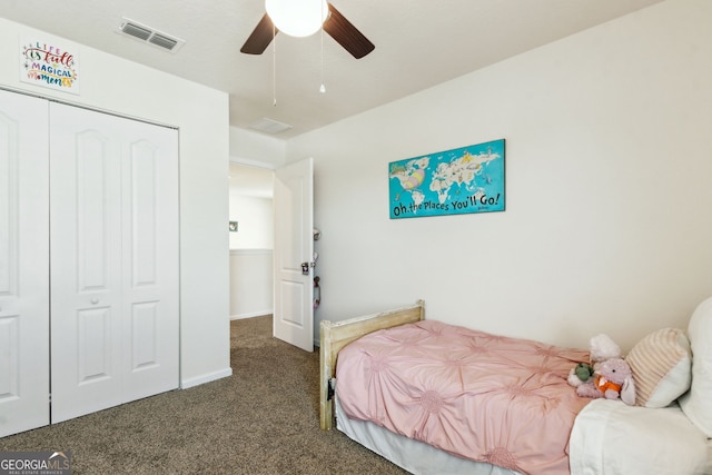 bedroom with carpet floors, a closet, visible vents, and a ceiling fan