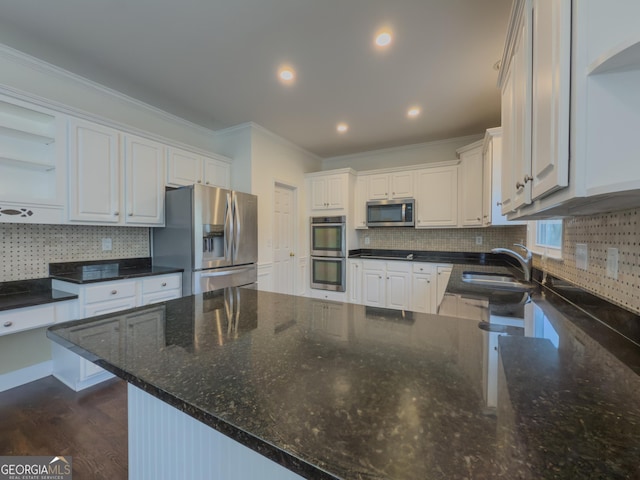 kitchen featuring appliances with stainless steel finishes, ornamental molding, white cabinetry, open shelves, and a sink