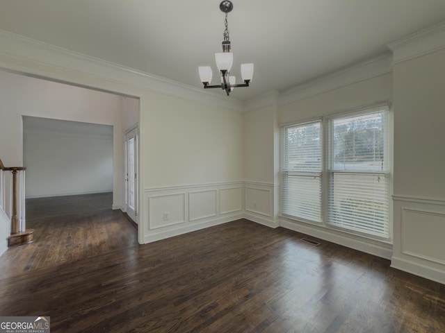 unfurnished dining area featuring crown molding, dark wood-style floors, visible vents, and an inviting chandelier