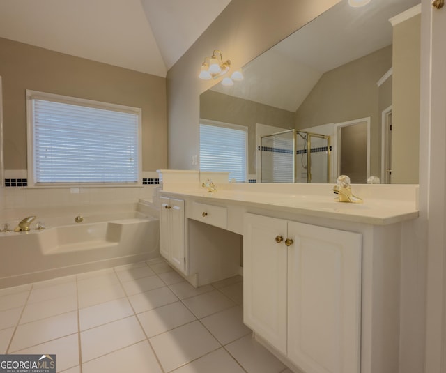 full bathroom with a stall shower, tile patterned floors, vaulted ceiling, vanity, and a bath