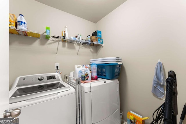 laundry room with washer and dryer and laundry area