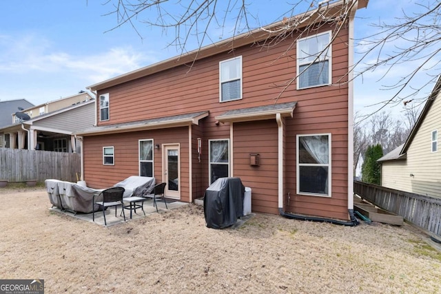 back of property featuring a patio area and a fenced backyard