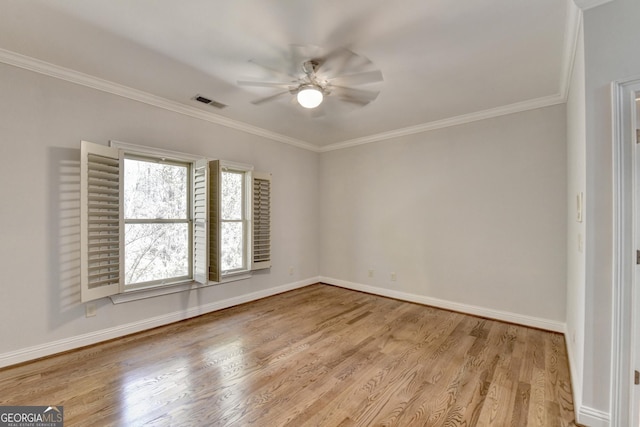 spare room with baseboards, visible vents, ceiling fan, and light wood finished floors