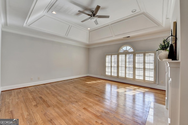 interior space featuring baseboards, visible vents, coffered ceiling, and wood finished floors