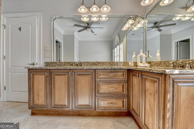 full bathroom with ornamental molding, a sink, and a ceiling fan