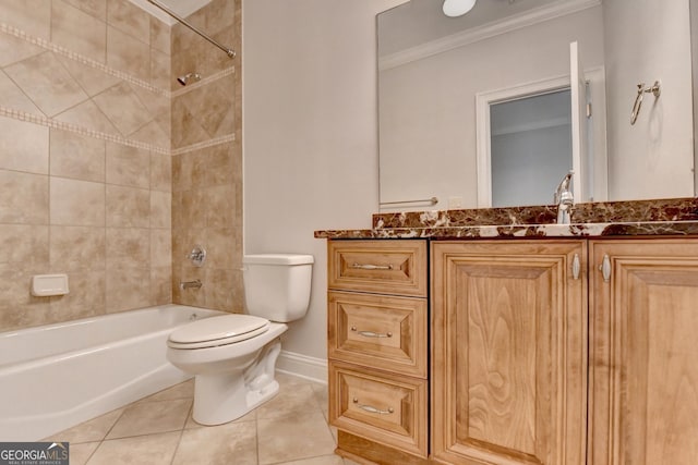 bathroom featuring bathing tub / shower combination, toilet, ornamental molding, vanity, and tile patterned flooring